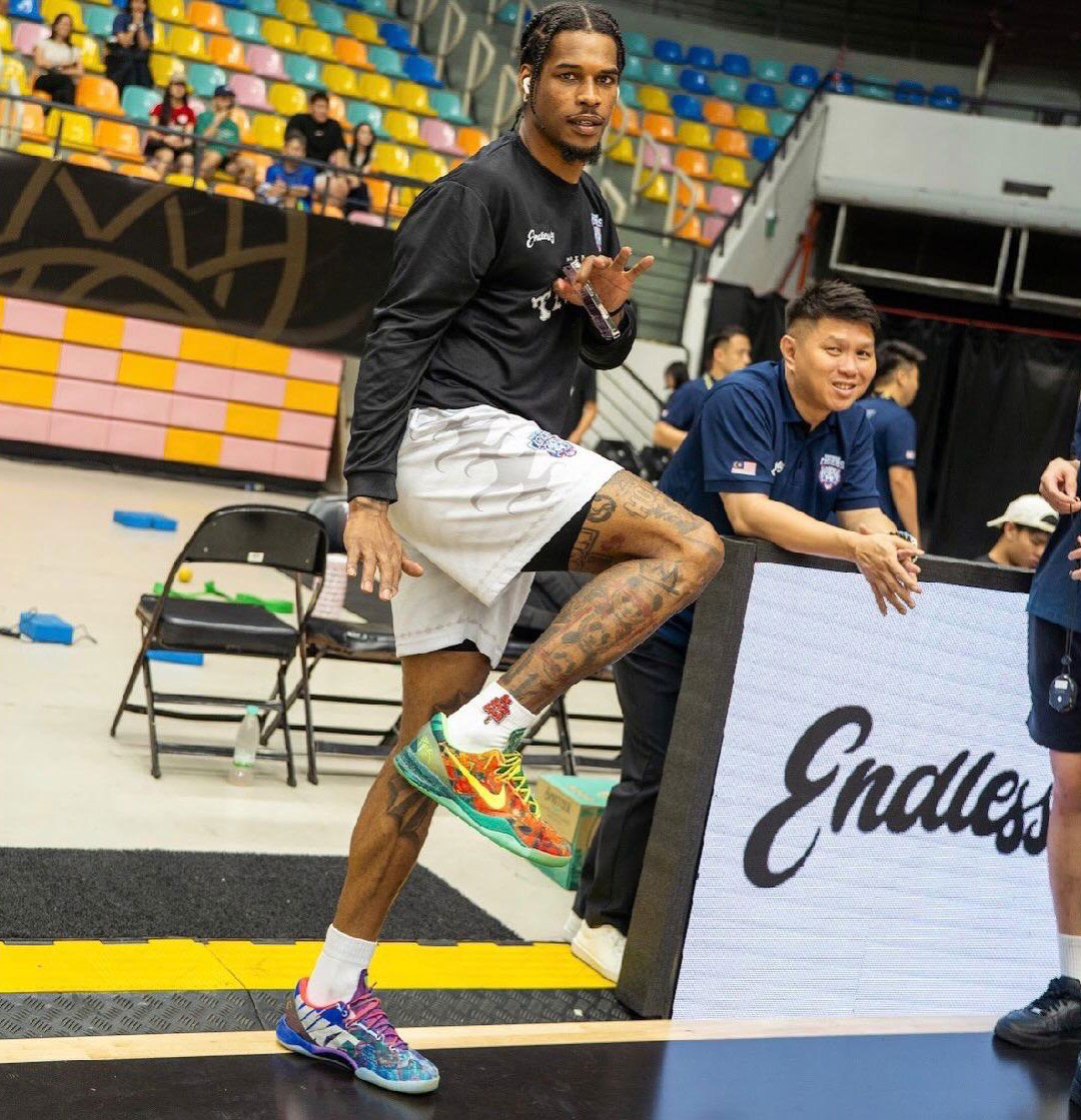 Ahmed Hill wearing his Nike Kobe 8 Protro "What The Kobe" basketball shoes, highlighting his style and love for fashion
