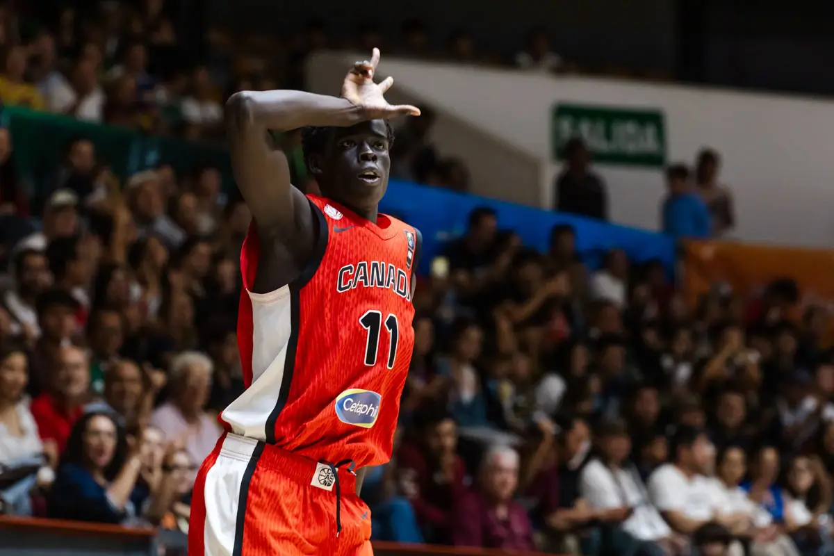 Deng Ngor celebrates after hitting a crucial three-pointer against the United States in the U18 AmeriCup final.