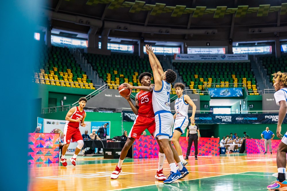 Canadian forward paul osaruyo looks for open teammate against dominican republic at the 2023 fiba u16 americas championships