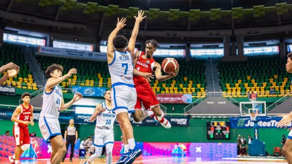 Canadian guard Kamai Samuels drives to the basket and delivers a tasty assist to teammate Paul Osaruyi during the opening game of the 2023 FIBA U16 Americas Championships in the city of Mérida in Yucatán, Mexico.