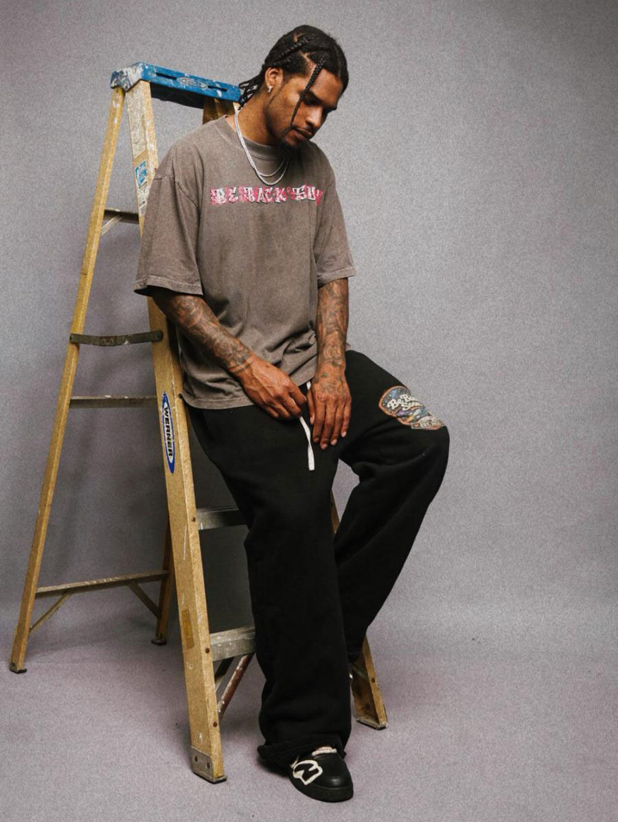 Ahmed Hill Posing Beside Ladder For For Be Back Clothing Line