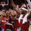 Bam Adebayo celebrates with teammates at half court after scoring 83 points for the Miami Heat in a historic win over the Washington Wizards, recording the second-highest scoring game in National Basketball Association history.