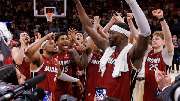 Bam Adebayo celebrates with teammates at half court after scoring 83 points for the Miami Heat in a historic win over the Washington Wizards, recording the second-highest scoring game in National Basketball Association history.