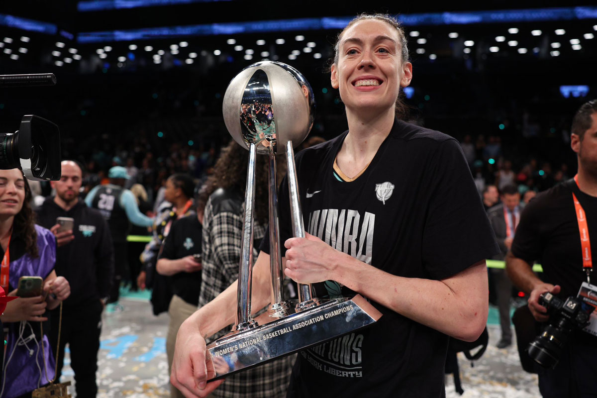 Breanna stewart holding the 2024 wnba trophy