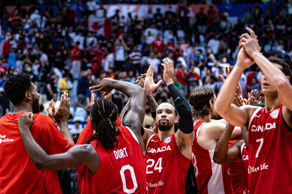 Canada celebrates at half court following their stunning 88 85 comeback win over spain in the 2023 fiba world cup