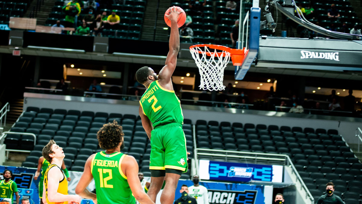 Canadian basketball player eugene omoruyi skies for one hand dunk while for the oregon ducks