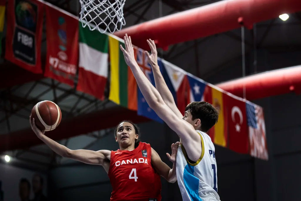 Canadian guard jordan charles goes in for a layup against argentina 2024 fiba u17 world cup