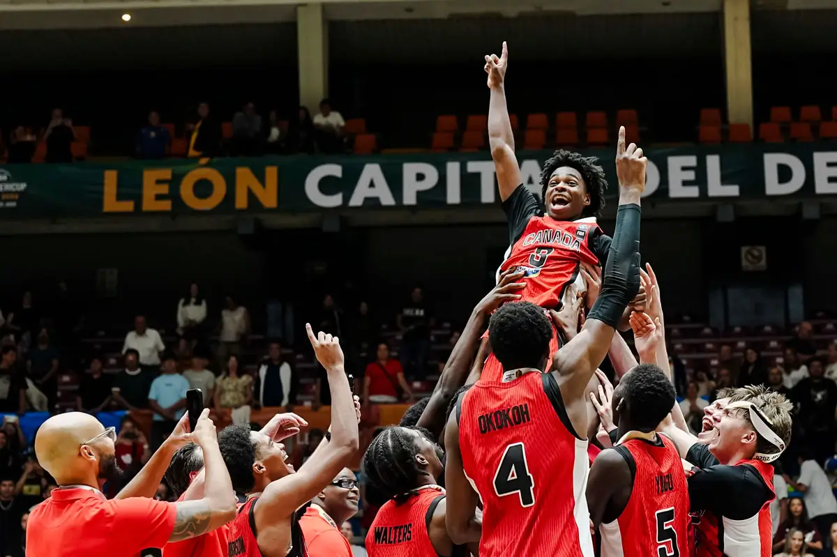Javion Tyndale celebrates with teammates after Canada wins the 2026 FIBA U18 AmeriCup title.