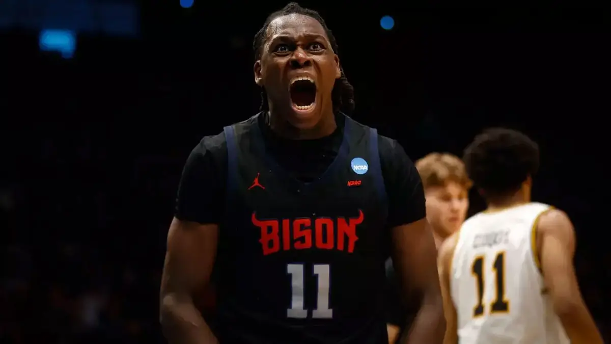 Canadian guard Ose Okojie reacts after leading Howard to its first-ever NCAA Tournament victory with a career-high performance.