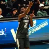 Miles Sadler rises to the moment—celebrating after drilling a clutch three-pointer at the 2026 Nike Hoop Summit, where the Canadian point guard delivered an MVP performance on the global stage.