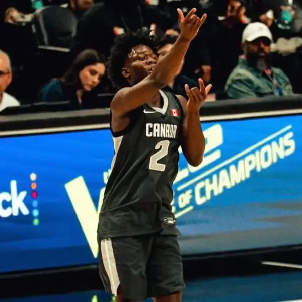 Miles Sadler rises to the moment—celebrating after drilling a clutch three-pointer at the 2026 Nike Hoop Summit, where the Canadian point guard delivered an MVP performance on the global stage.