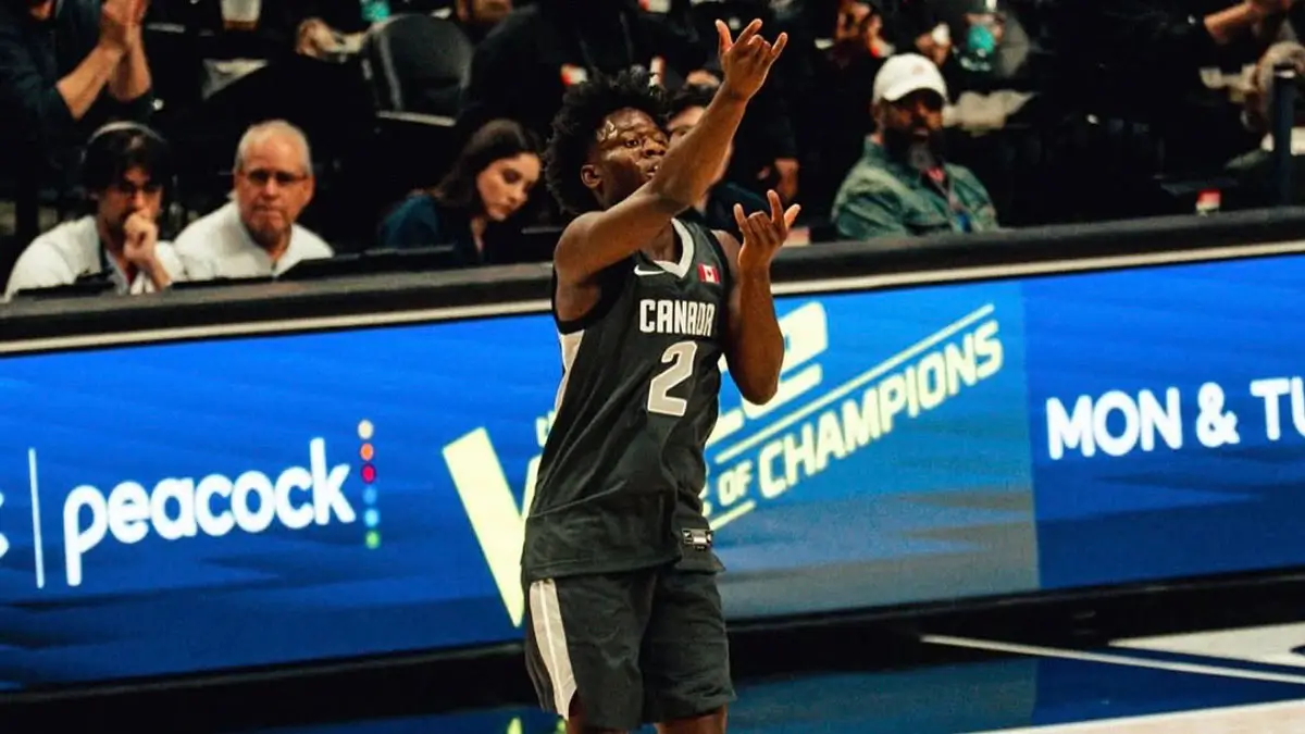 Miles Sadler rises to the moment—celebrating after drilling a clutch three-pointer at the 2026 Nike Hoop Summit, where the Canadian point guard delivered an MVP performance on the global stage.