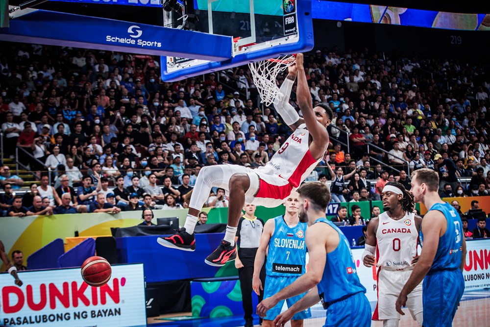 Canadian rj barrett completes a two hand dunk in 100 89 win over slovenia