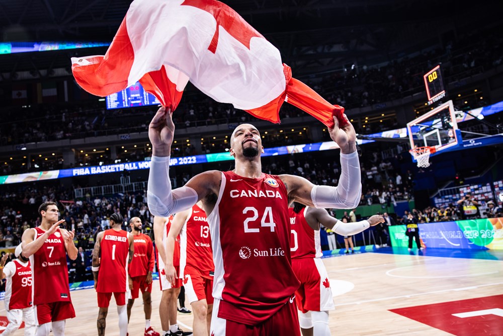 Dillon brooks waves canadian flag following after canada defeated the usa 127 118 in overtime to win the bronze medal