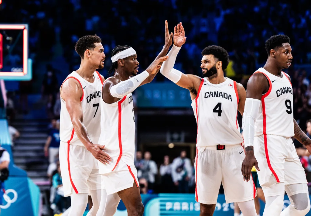 Dwight powell shai gilgeous alexander jamal murray and rj barrett walk off the court