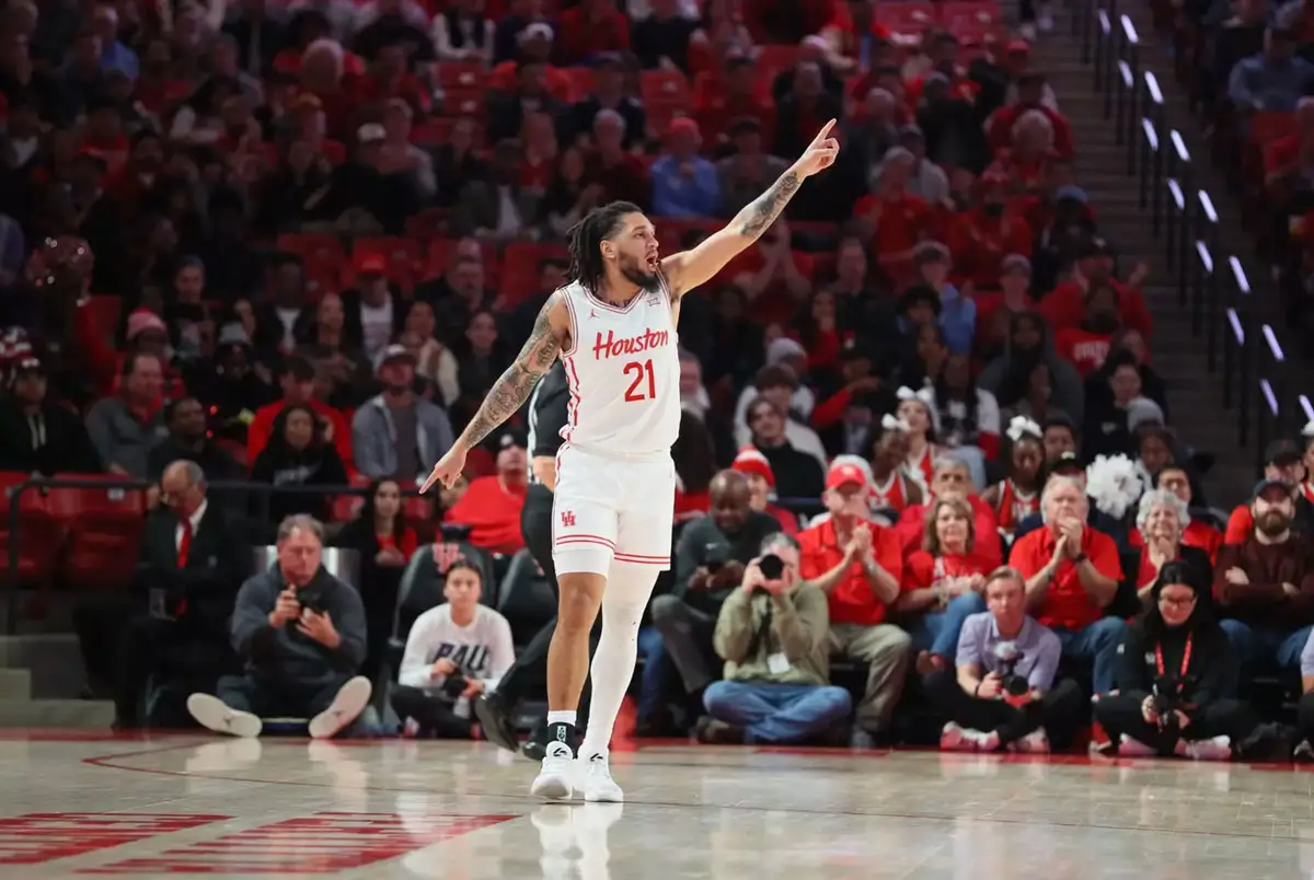 Tampa native Emanuel Sharp of the Houston Cougars gestures to a teammate during the 2025–26 NCAA basketball season.