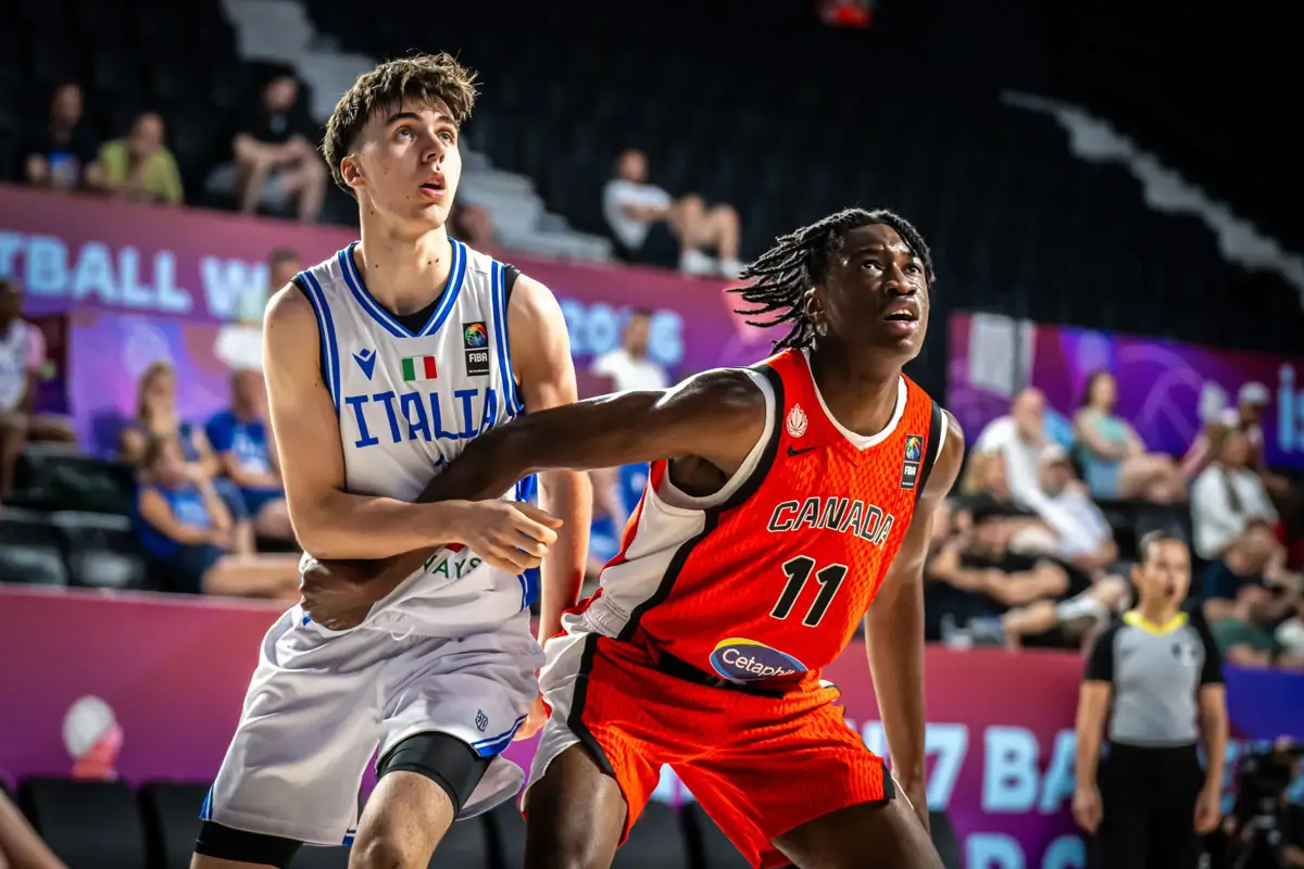 Grady Kapuanya boxes out for a rebound during Canada’s FIBA U17 World Cup 2026 game against Italy.
