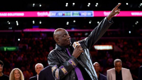 Hanging jerseys with Lakers legend Michael Cooper