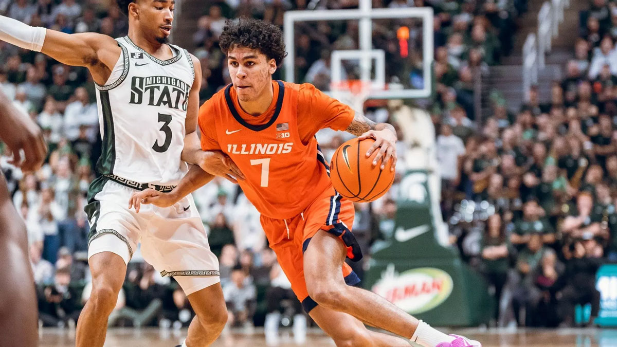 Illinois canadian freshman will riley attacks the basket against michigan state