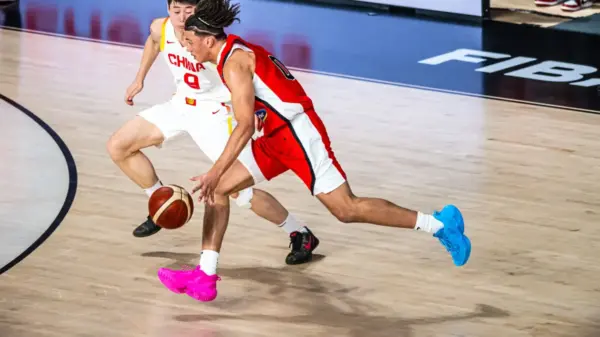 Isaiah Clarke blows by a Chinese defender above the arc during Canada’s FIBA U17 World Cup clash with China, part of a 19-point, 18-rebound double-double that included a historic Canadian rebounding mark at the tournament level.