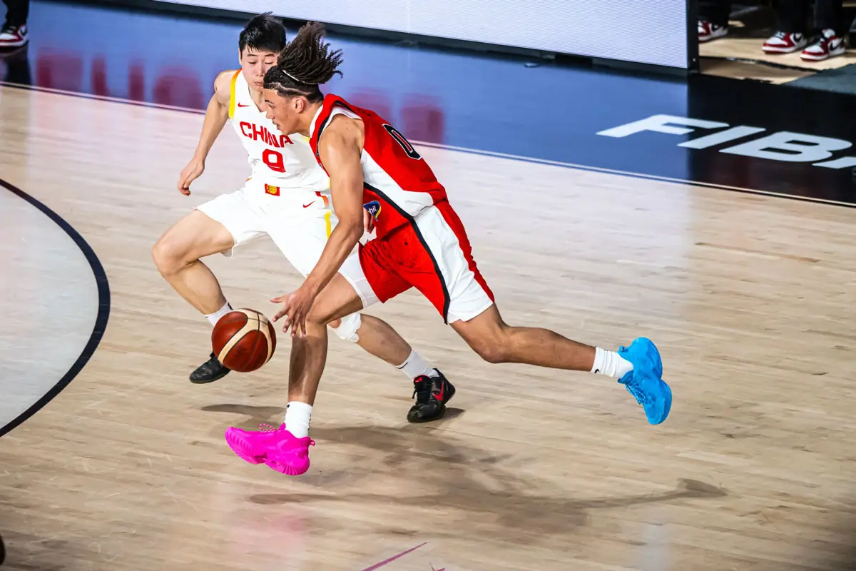 Isaiah Clarke blows by a Chinese defender above the arc during Canada’s FIBA U17 World Cup clash with China, part of a 19-point, 18-rebound double-double that included a historic Canadian rebounding mark at the tournament level.