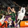Jokubas Kukta (12) attacks the basket during Lithuania's 103–89 victory over Canada. Kukta finished with 29 points, 10 assists and eight rebounds, narrowly missing what would have been just the second triple-double in FIBA U17 World Cup history.