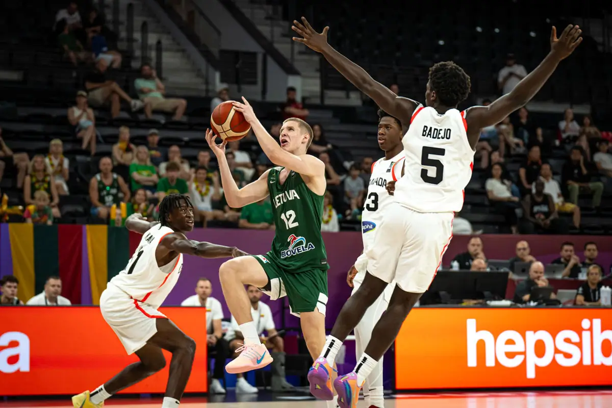 Jokubas Kukta (12) attacks the basket during Lithuania's 103–89 victory over Canada. Kukta finished with 29 points, 10 assists and eight rebounds, narrowly missing what would have been just the second triple-double in FIBA U17 World Cup history.