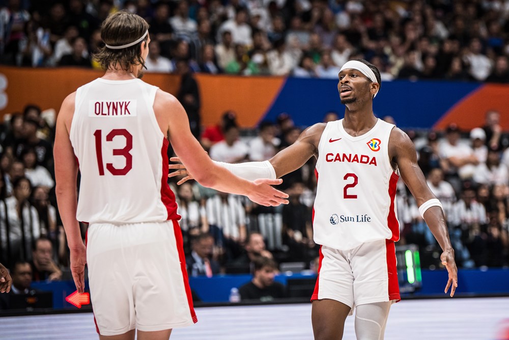 Kelly olynyk and shai gilgeous alexander touch hands during canadas 95 65 win over france at the 2023 fiba world cup