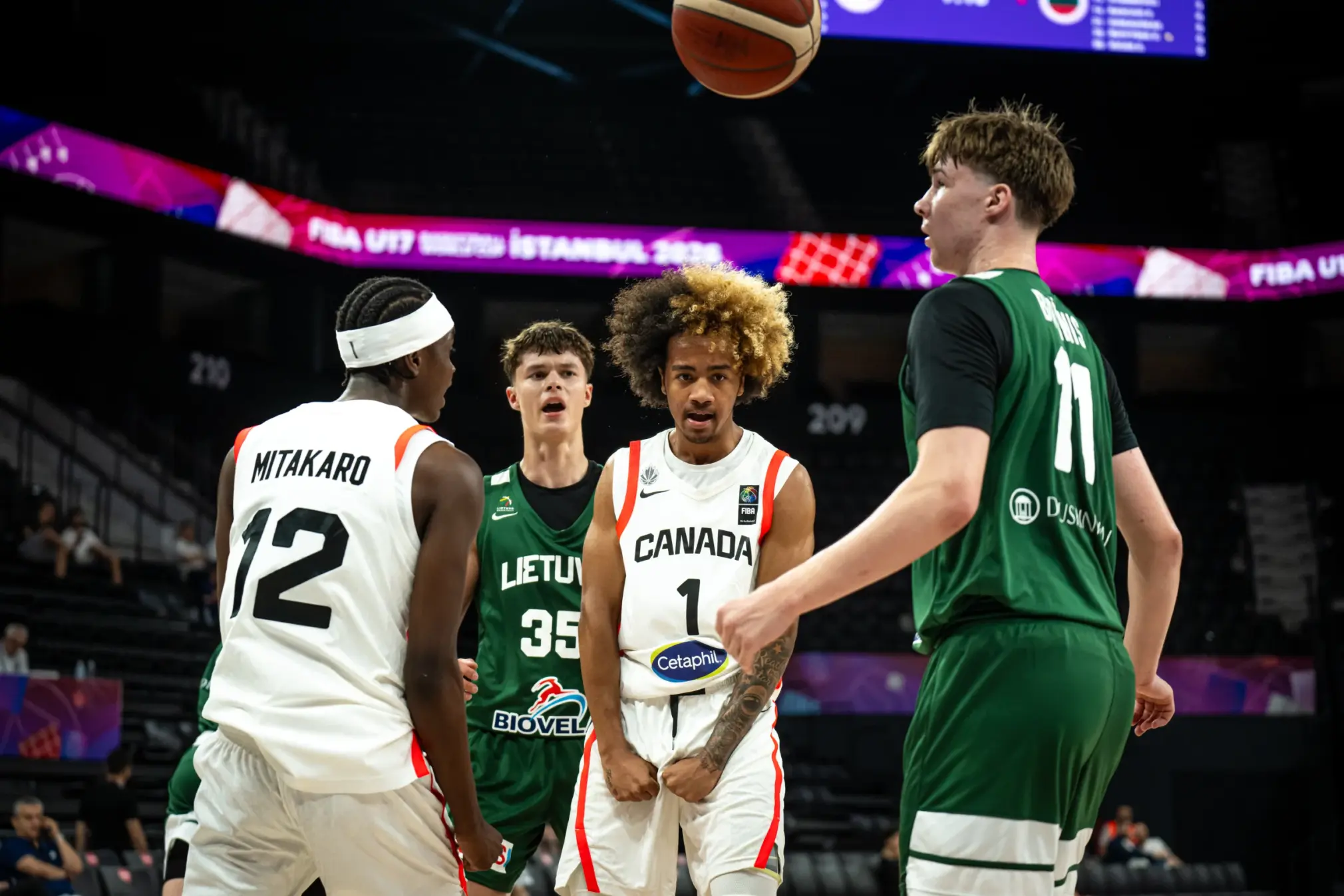 kenyon st louis flexs beside liam mitakaro after scoring tough basket canada vs lithuania fiba u17 world cup 2026