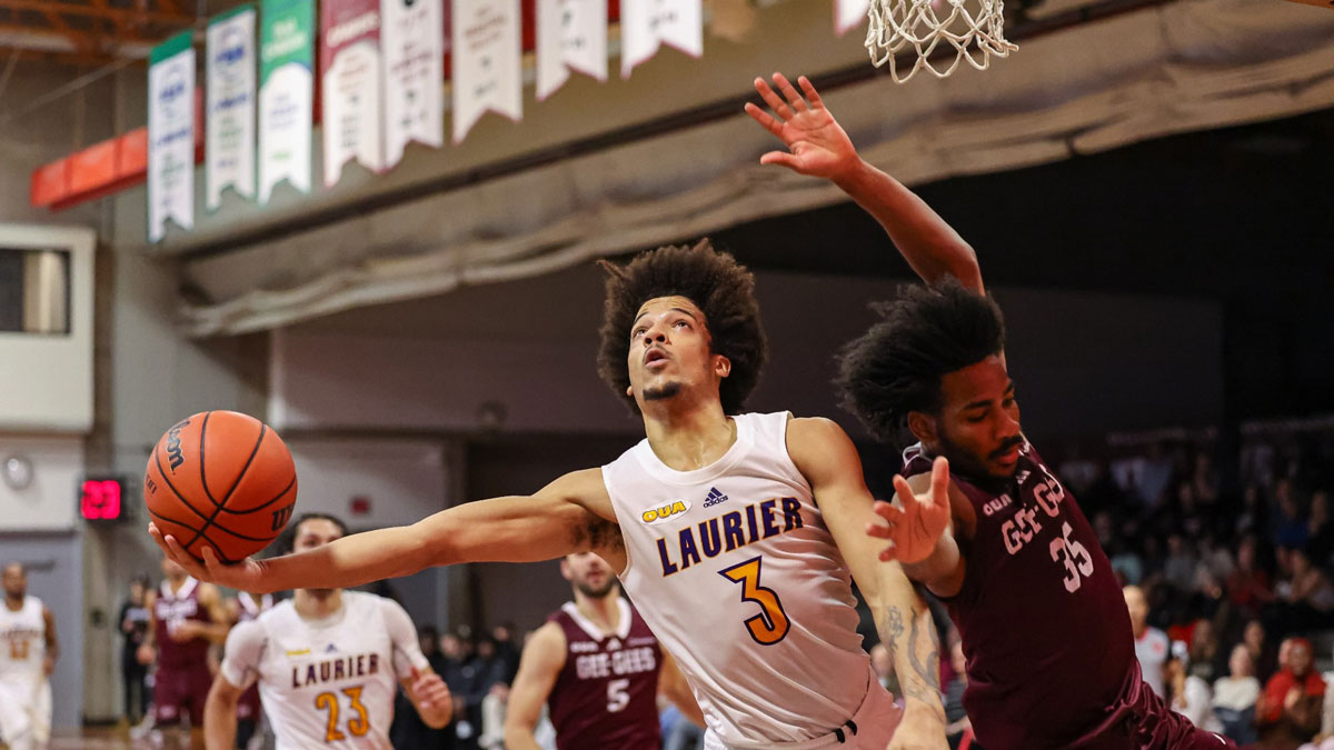Laurier golden hawks point guard taye donald races to hoop for a tough lay up against the ottawa gee gees