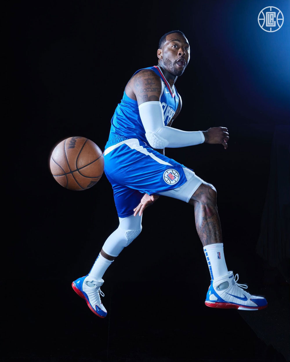 Los Angeles Clippers guard John Wall tosses the ball behind back pass 2022-23 NBA media day