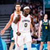 Luguentz dort flexes muscles after hitting a three pointer against australia