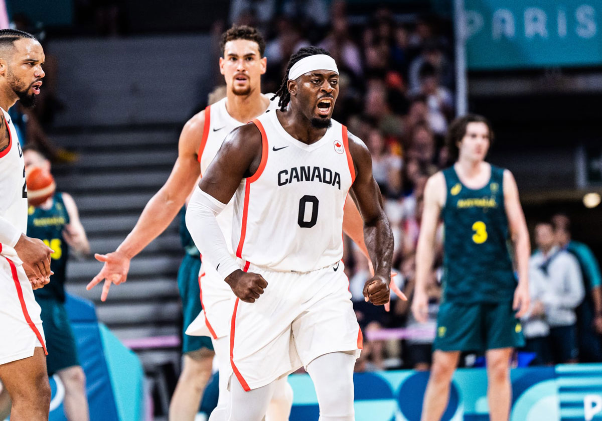 Luguentz dort flexes muscles after hitting a three pointer against australia