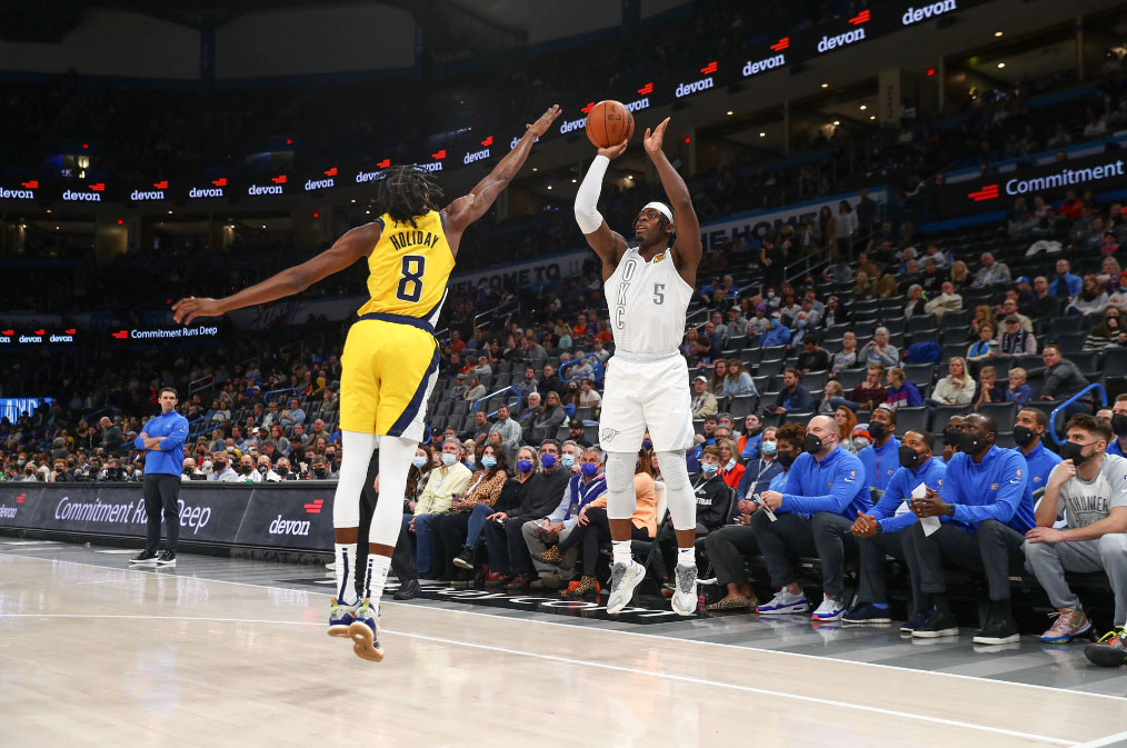 OKC Thunder Canadian guard Luguentz Dort shoots a three pointer over Indiana Pacers Aaron Holiday