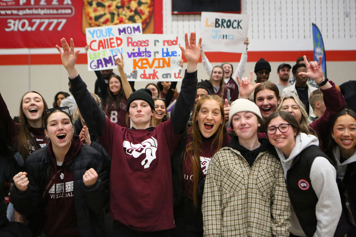 Ottawa gee gees fans cheering and holding signs during 79 57 win over the carleton ravens
