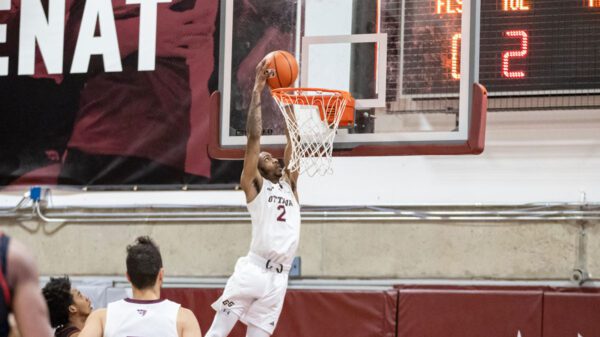 Ottawa Gee-Gees guard Kevin Otoo slams home a two hand dunk to help the Gee-Gees defeat the Carleton Ravens