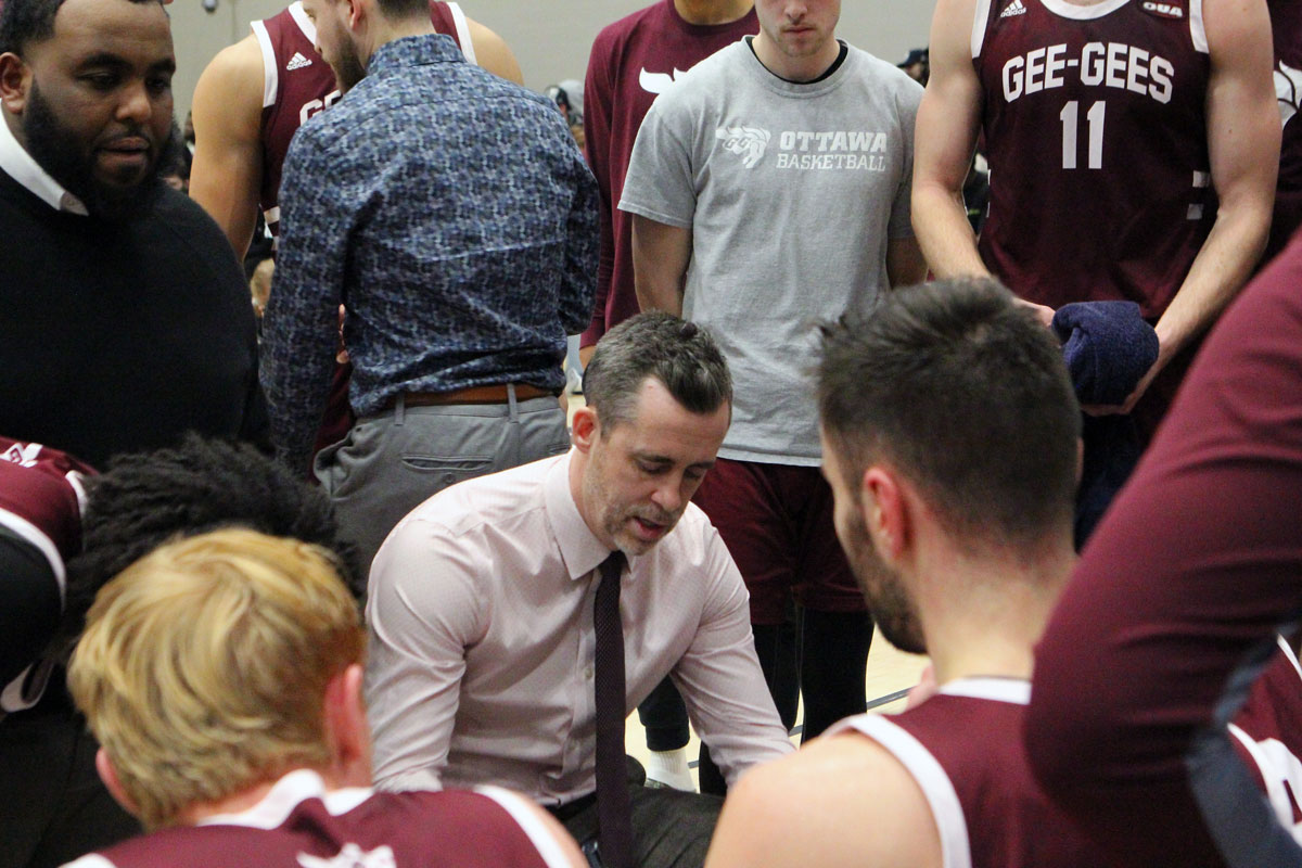 Ottawa gee gees head coach james derouin in huddle at ravens nest
