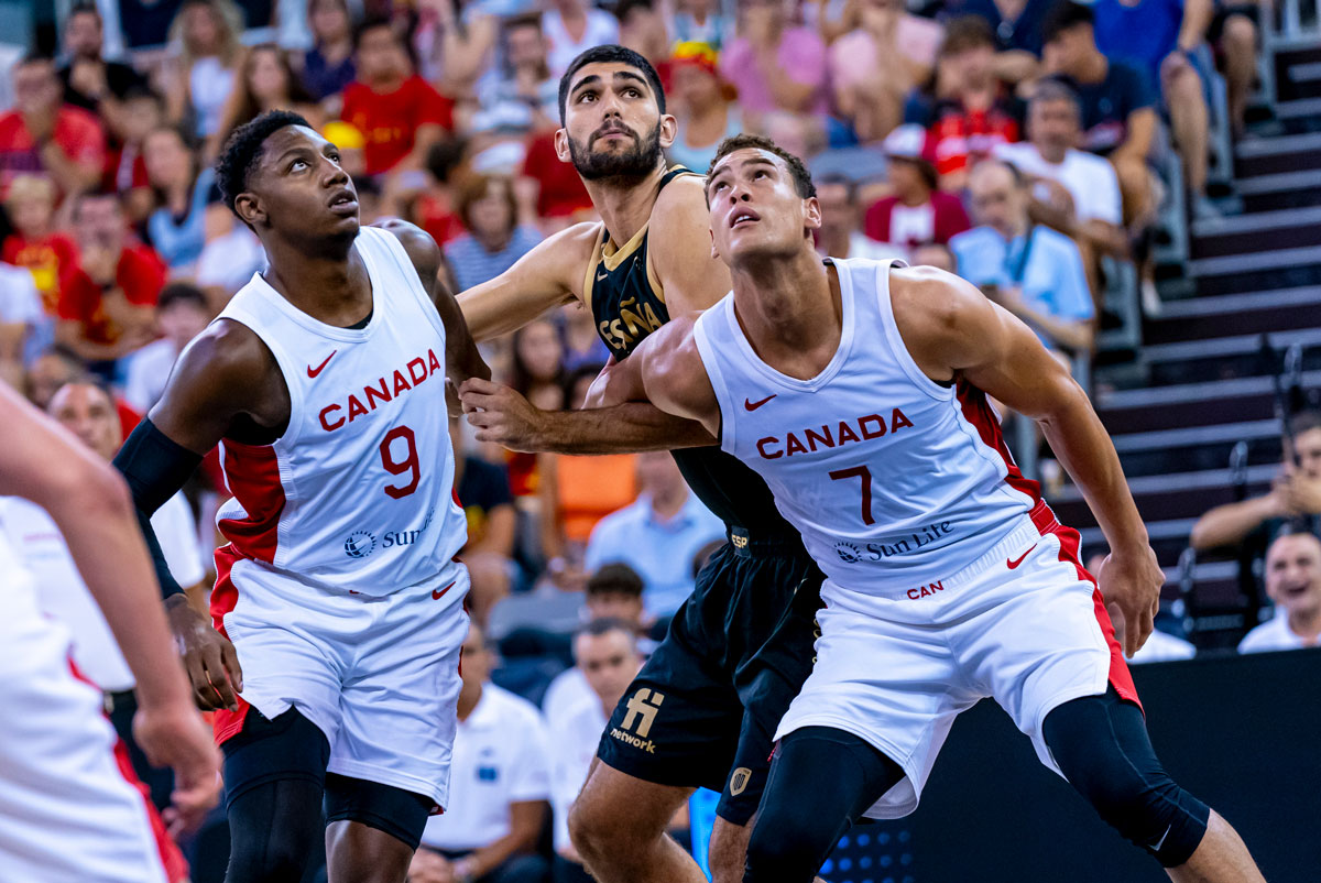 RJ Barrett (18 points, 6/11 FG) and Dwight Powell (12 points, 12 rebounds) box out Santi Aldam to help lead Canada to an 85-80 overtime win over top-ranked Spain in pre-FIBA World Cup 2023 exhibition action.