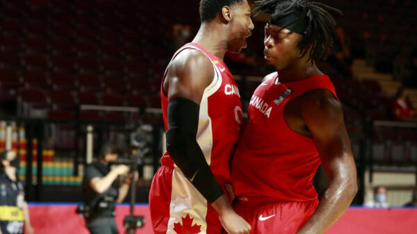 RJ Barrett and Luguentz Dort chest bump during Team Canada 97-91 victory over Greece at the 2020 FIBA Olympic Qualiying Tournament in Victoria, British Columbia