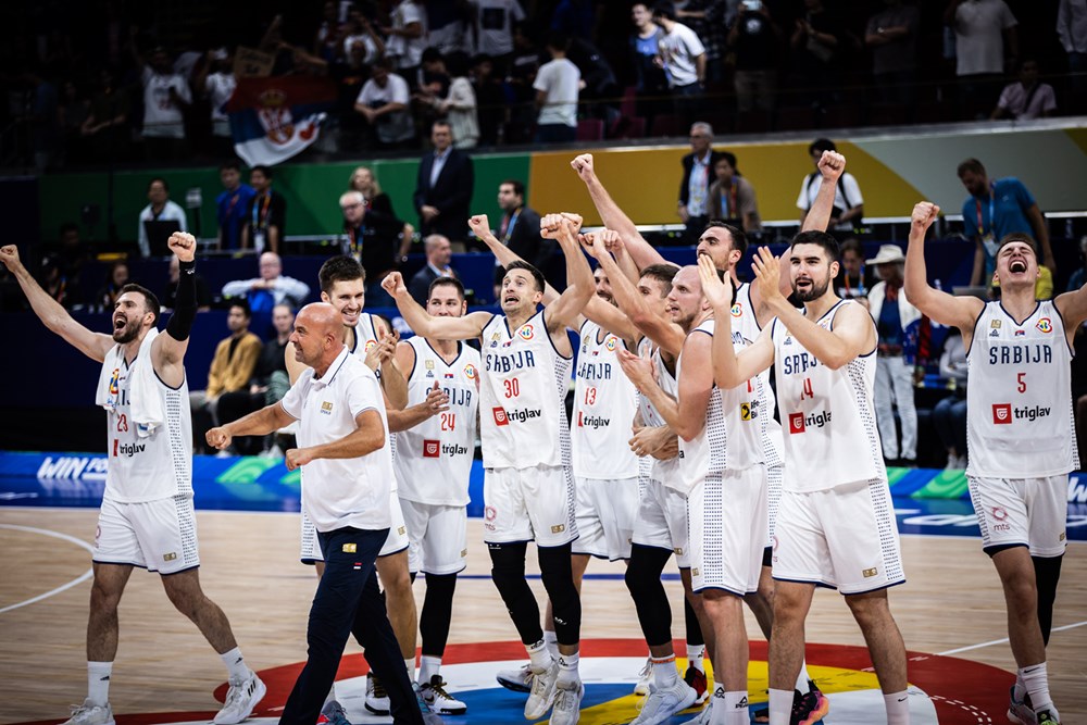 Serbia celebrates following their 95 86 win over canada to advance to 2023 fiba world cup gold medal game