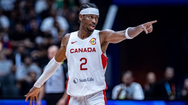 Shai Gilgeous-Alexander points to the Canadian bench after scoring two of his game-high 27 points (9/19 FG, 8/9 FT) as Canada blows out France 95-65 in 2023 FIBA Basketball World Cup opener