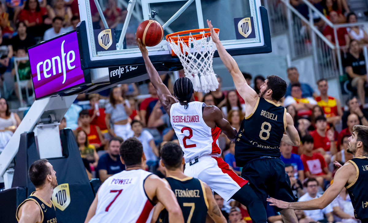 Shai Gilgeous-Alexander scores a left-hand layup over Dario Brizuela as Canada defeats Spain in pre-FIBA World Cup 2023 exhibition action.