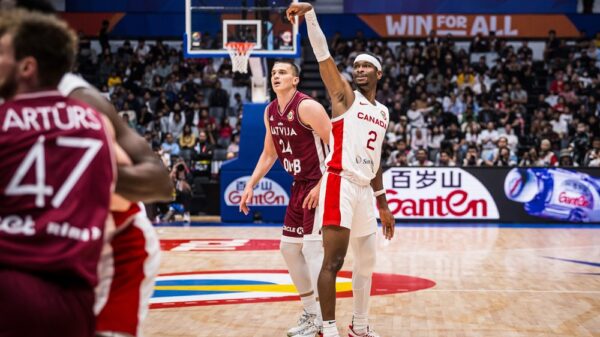 Shai gilgeous alexander shoots a three pointer as canada beats latvia 101 75 to win preliminary group for first time in fiba world cup history