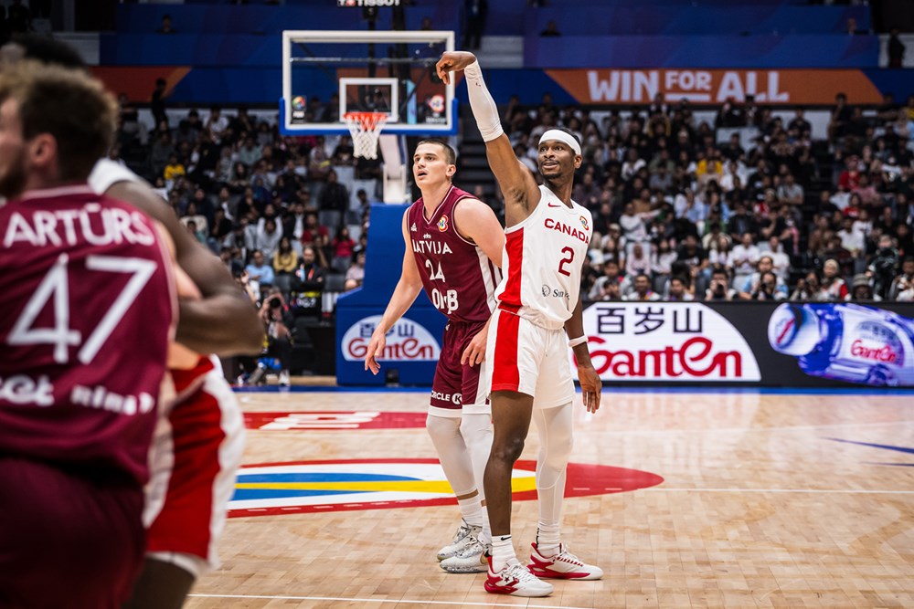Shai gilgeous alexander shoots a three pointer as canada beats latvia 101 75 to win preliminary group for first time in fiba world cup history