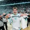 Simon Hildebrandt points to the Winnipeg Sea Bears logo on his jersey as photographers capture the moment and confetti falls from the rafters after his game-winning three-pointer gave Winnipeg its first CEBL championship.