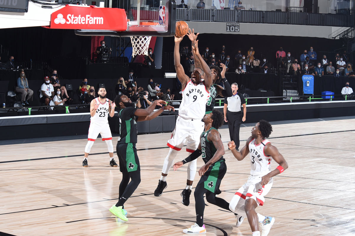 Toronto Raptors Serge Ibaka Fights Off Multiple Boston Celtics Defenders Grabs Offensive Rebound 2020 Nba Playoffs
