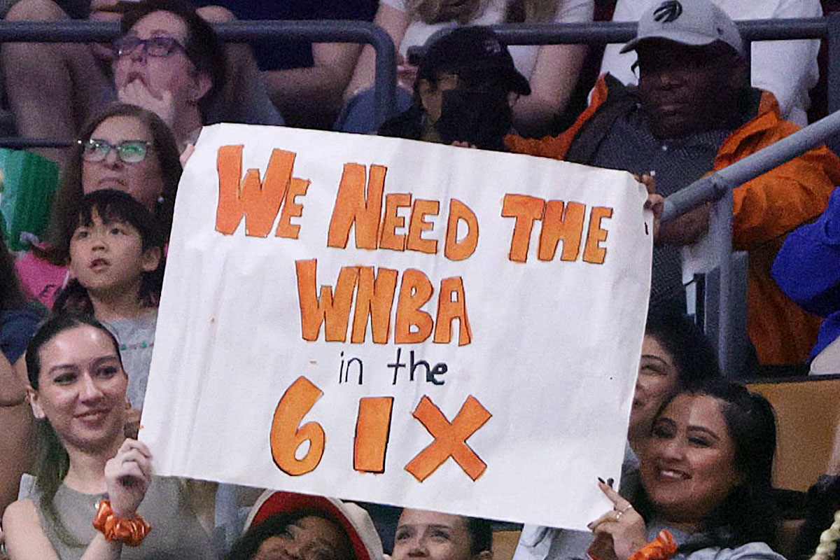 Toronto wnba fans hold we need the wnba in the six during wnba canada game in 2023