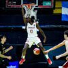 Tristan beckford hangs on the rim after throwing down a big alley oop dunk against brazil in the quarter finals of the 2024 fiba u18 americup