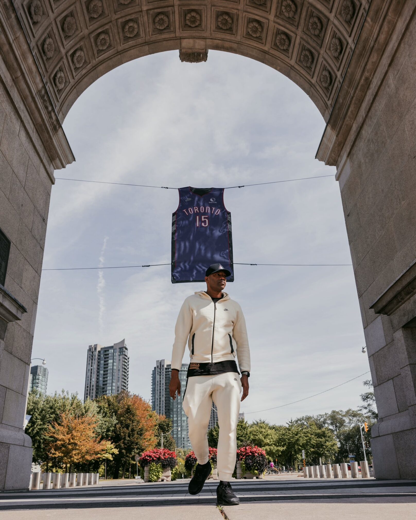 Vince carter walks as his number 15 toronto raptors jersey hangs from above